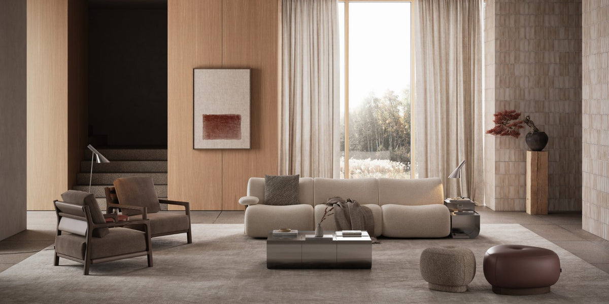 Modern living room with beige sofa, armchairs, and coffee table.